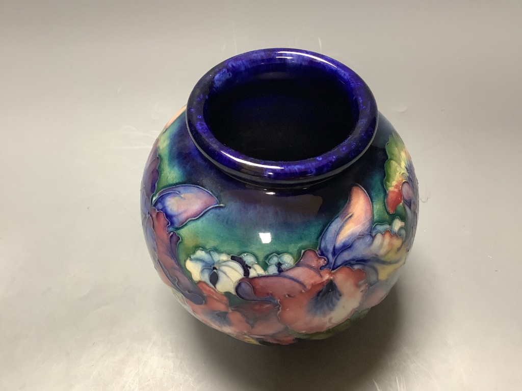 A Moorcroft blue ground bulbous Orchid pattern vase, H 15cm